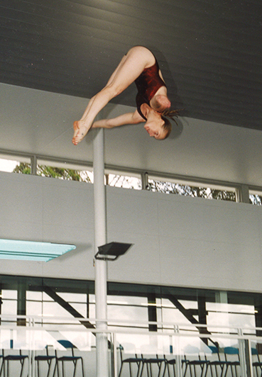 Vanessa Baker diving into MLC School pool_369x532